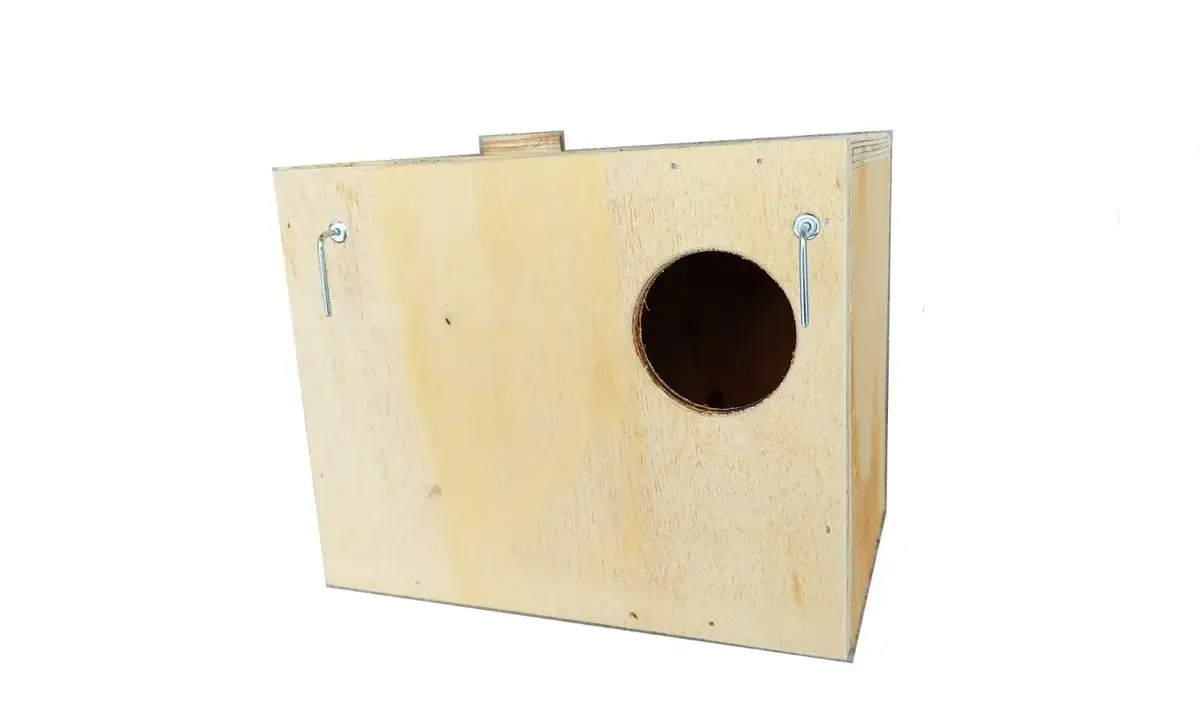 Wooden birdhouse with a circular entrance hole and two metal hanging hooks.