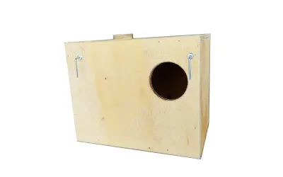 Wooden birdhouse with a circular entrance hole and two metal hanging hooks.